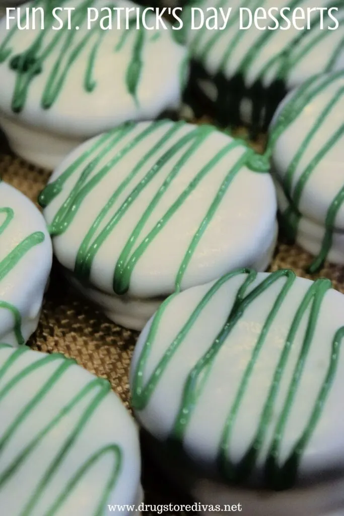 White chocolate covered round cookies with green zigzags on them with the words "Fun St. Patrick's Day Desserts" digitally written on top.