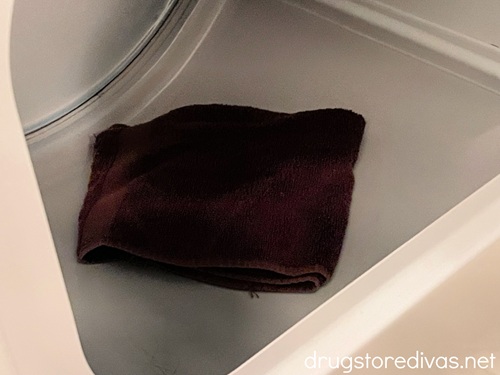 A brown towel inside a dryer.