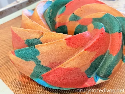 A red, white, and blue Bundt cake on a cookie sheet.