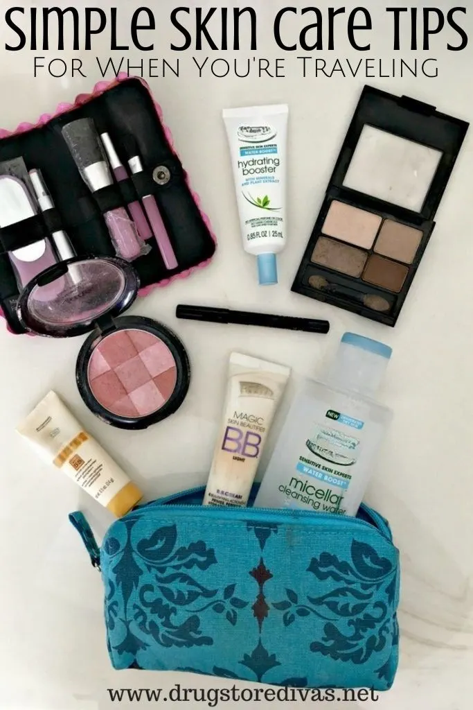 A blue travel bag with make up products scattered around and the words 