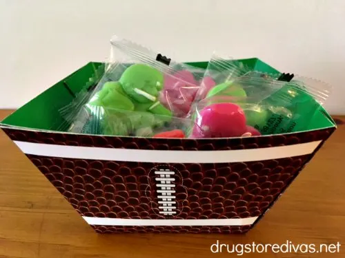 Football player-shaped candies in a football bowl.