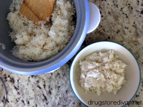 Rice in a rice cooker next to rice in a bowl.