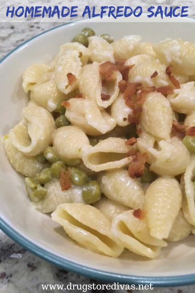 Shell pasta, peas, and crumbled bacon in a bowl with the words "Homemade Alfredo Sauce" digitally written on top.
