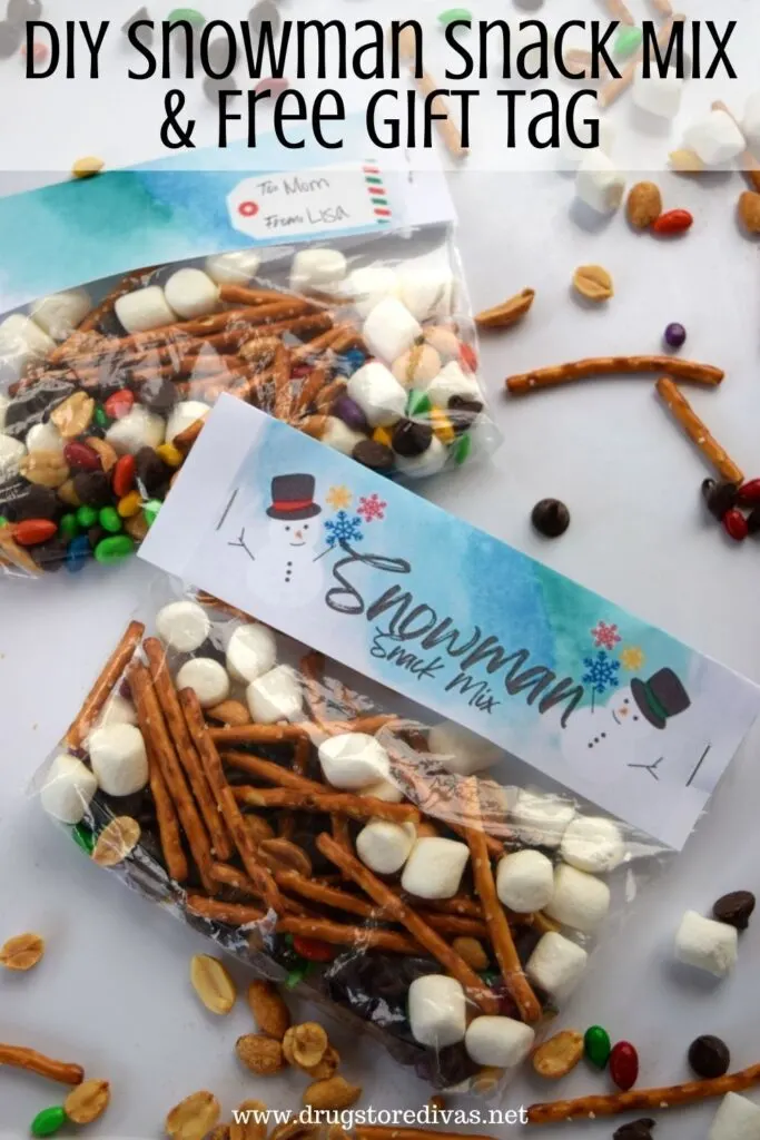Snowman trail mix in bags with the words "DIY Snowman Snack Mix & Free Gift Tag" digitally written on top.
