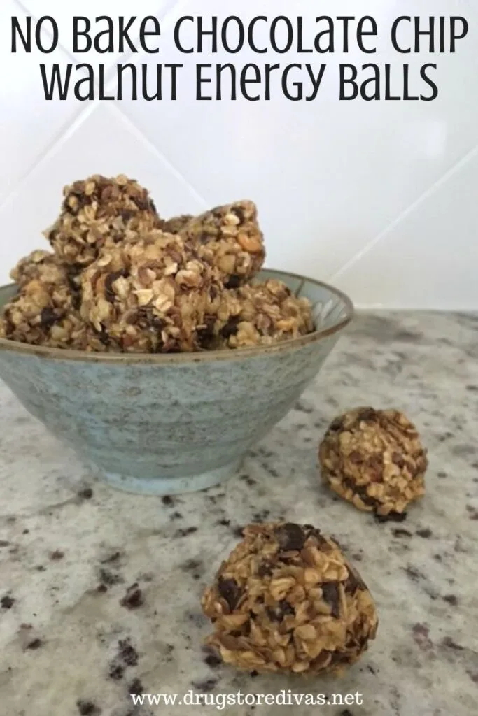 Energy balls in a turquoise bowl with some in front of it and the words "No Bake Chocolate Chip Walnut Energy Balls" digitally written on top.