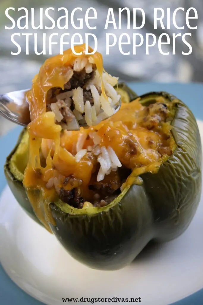 Peppers stuffed with sausage, rice, and onion on a plate with the words "Sausage And Rice Stuffed Peppers" digitally written on top.