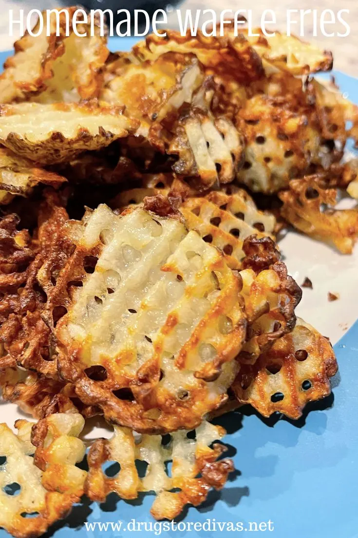 Waffle fries on a blue and white plate with the words 