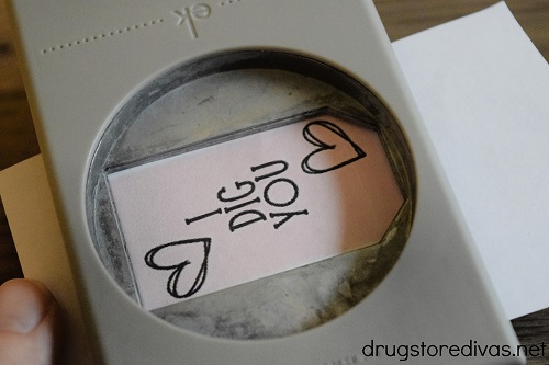 A tag that says "I Dig You" with two hearts in a tag-shaped paper punch.