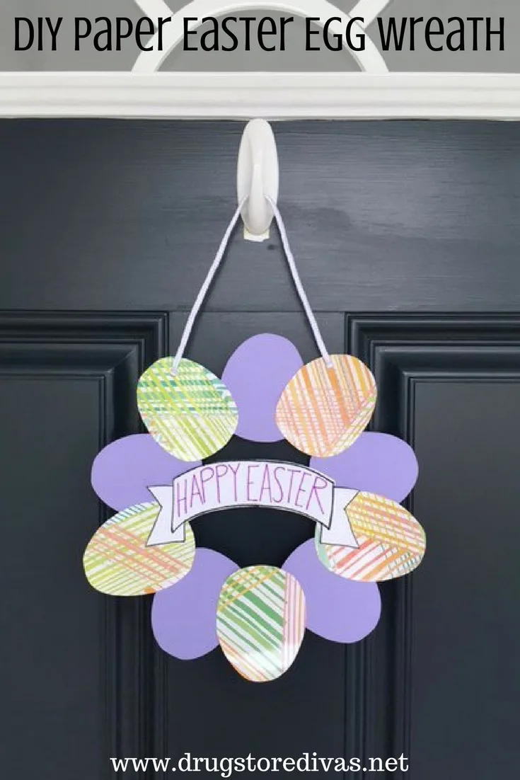 A homemade wreath hanging on a door with the words 
