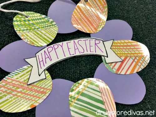 A paper Easter egg wreath with a Happy Easter banner in the middle.