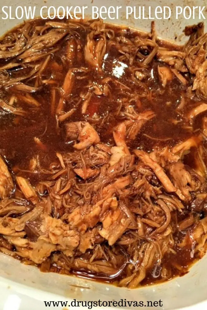 Pulled pork in a plastic container with the words "Slow Cooker Beer Pulled Pork" digitally written on top.