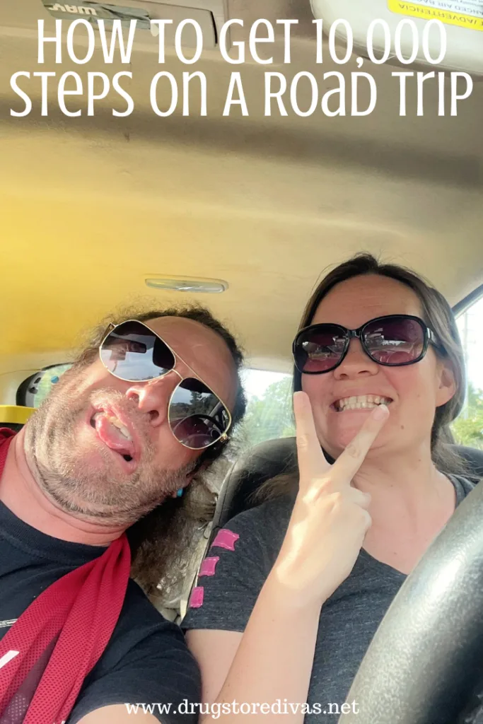A man and a woman in a car with the words "How To Get 10,000 Steps On A Road Trip" digitally written above them.
