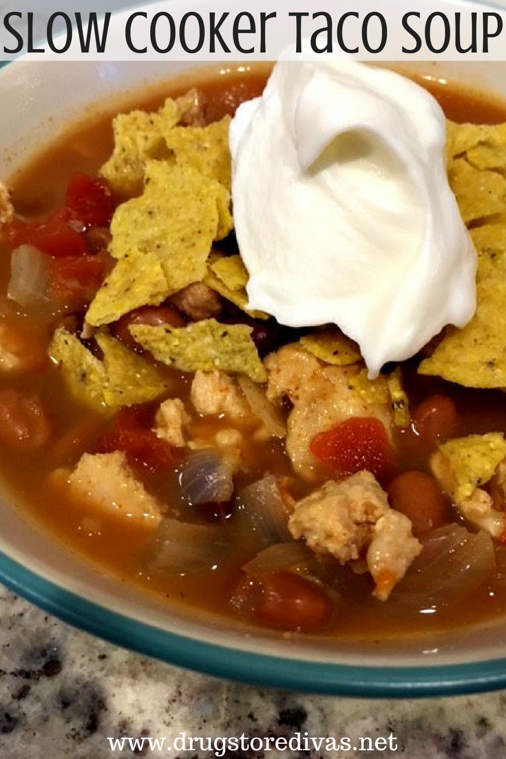 Soup in a bowl with the words "Slow Cooker Taco Soup" digitally written above it.