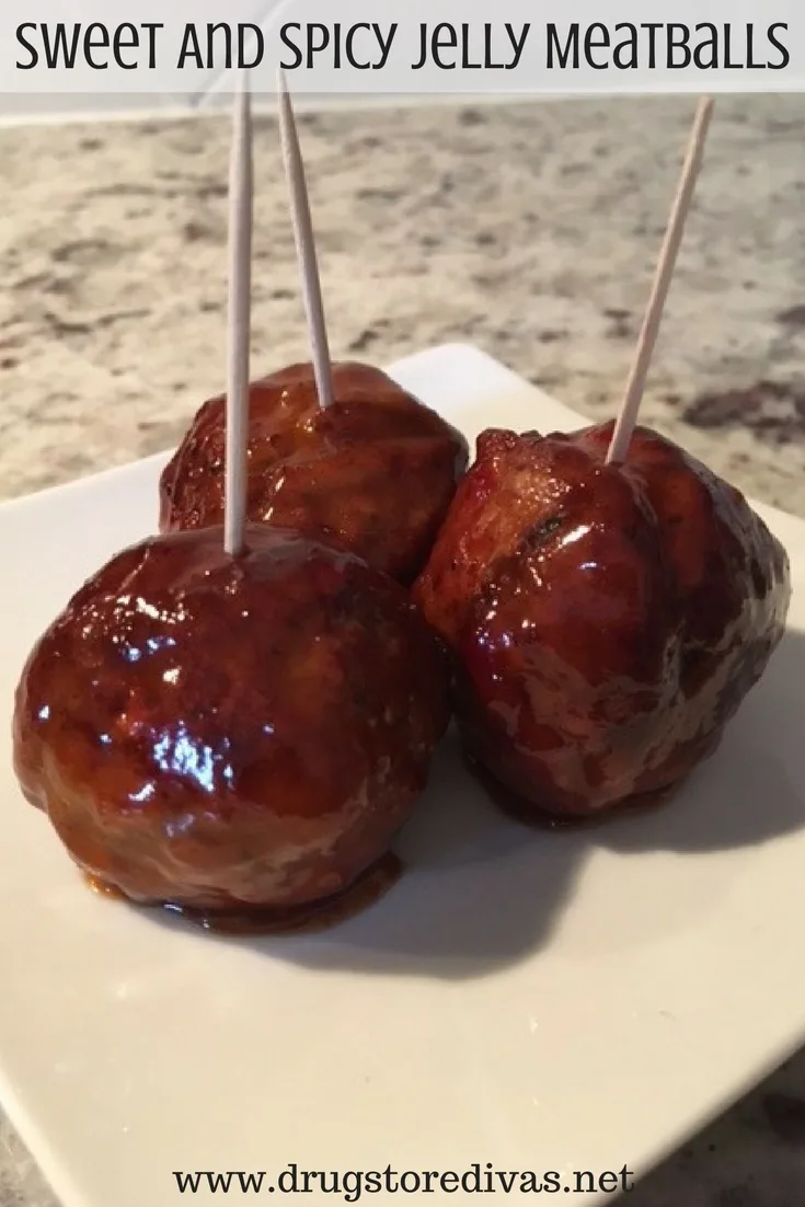 Three meatballs on a plate with toothpicks on them with the words "Sweet And Spicy Jelly Meatballs" digitally written above them.