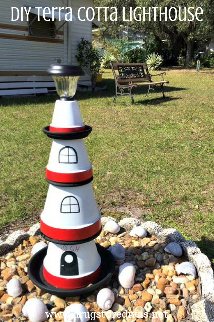 A lighthouse made from plant holders with the words "DIY Terra Cotta Lighthouse" digitally written on top.