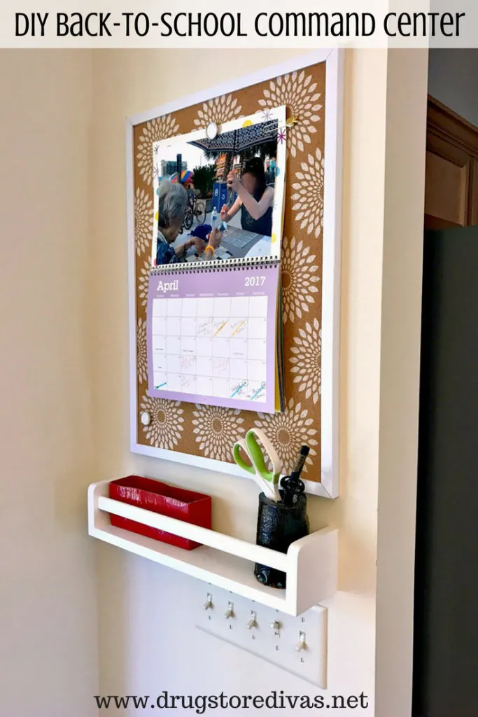 A command center hanging on a wall with the words "DIY Back-To-School Command Center" digitally written on top.