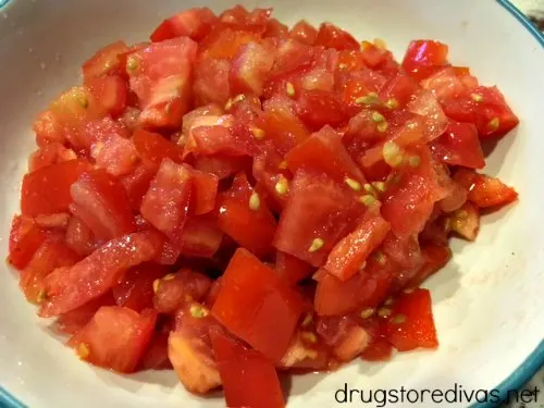 A perfect potluck appetizer is this Kale Pesto Bruschetta. Get the recipe at www.drugstoredivas.net.