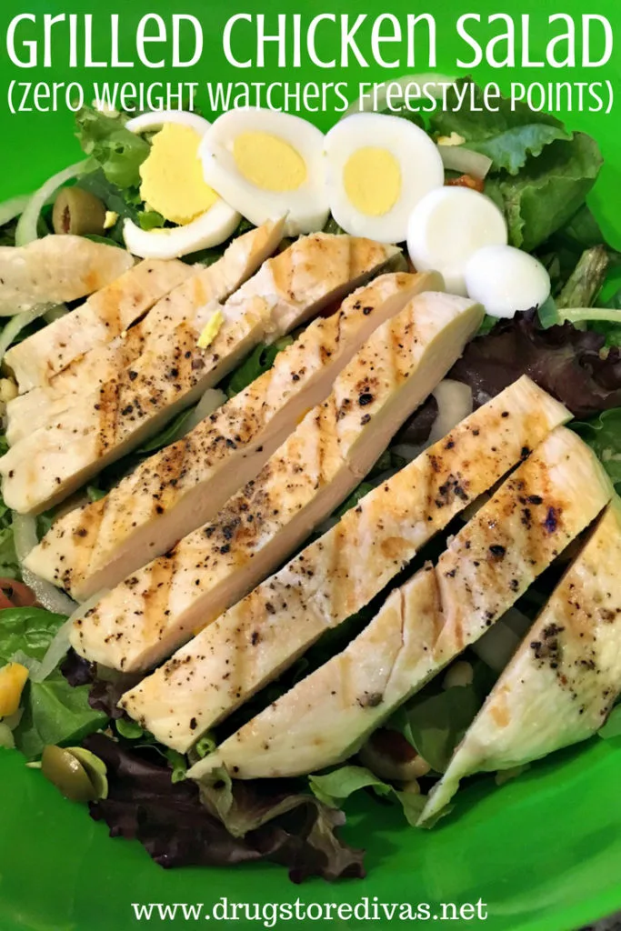 A salad with grilled chicken and hard boiled eggs in a green bowl and the words "Grilled Chicken Salad (Zero Weight Watchers Freestyle Points)" digitally written above it.