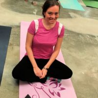 A woman on a yoga mat with the words 