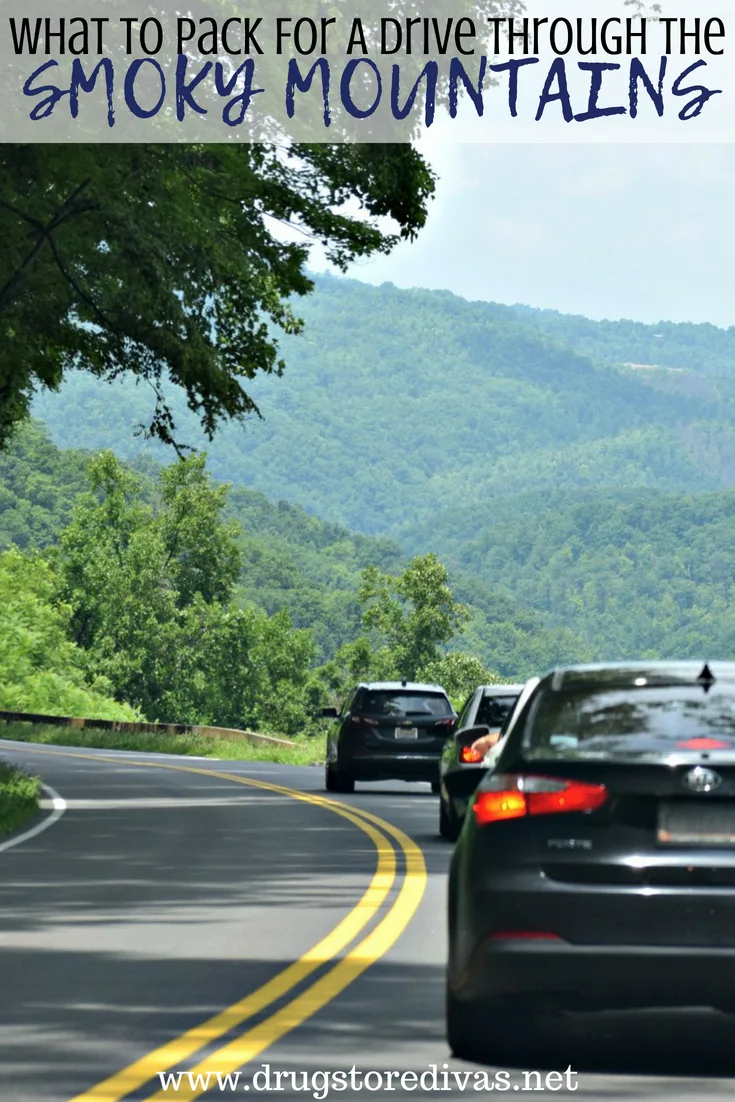 Cars driving through the mountains with the words 