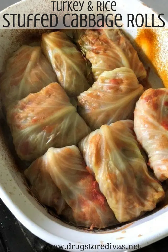 Cabbage rolls in a casserole pan with the words "Turkey & Rice Stuffed Cabbage Rolls" digitally written on top.