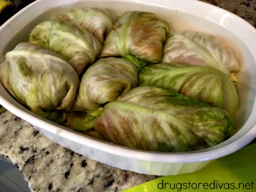 Stuffed cabbage rolls in a casserole pan.