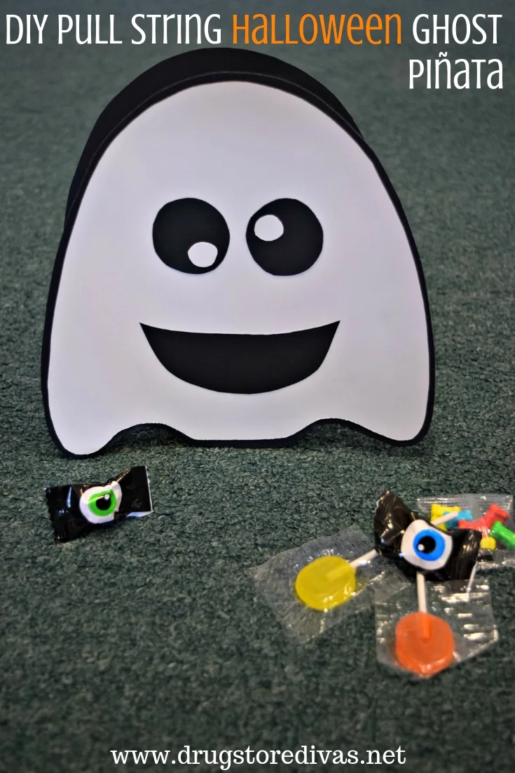 A paper ghost surrounded by candy and the words "DIY Pull String Halloween Ghost Pinata" digitally written on top.