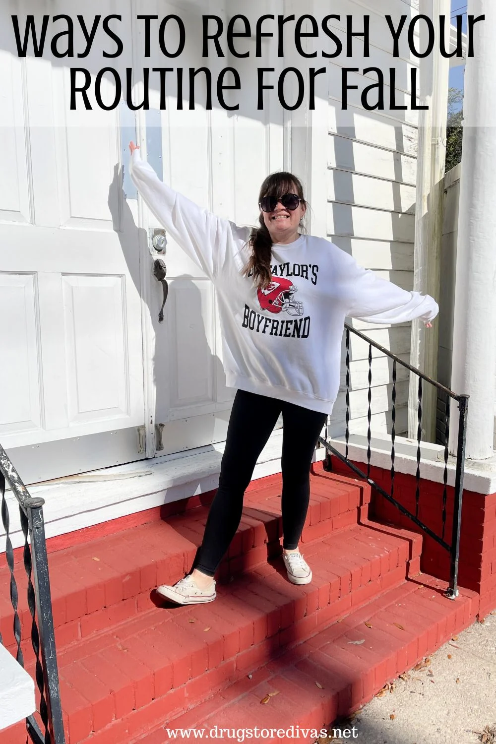 A woman in a white sweatshirt that says 