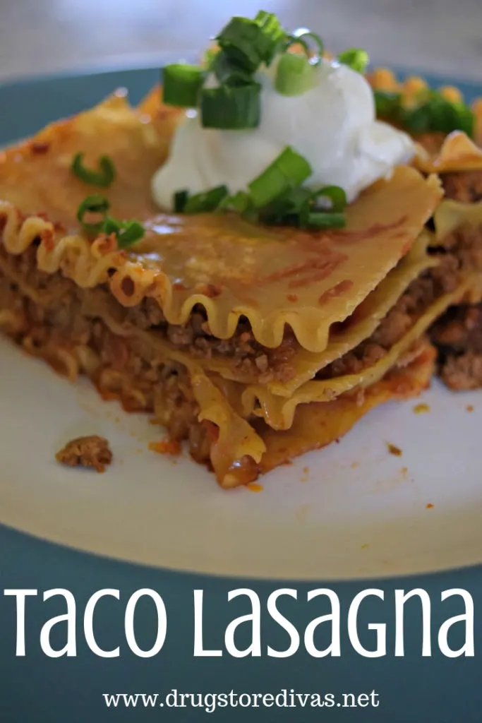 A lasagna with sour cream on top on a plate with the words "Taco Lasagna" digitally written under it.