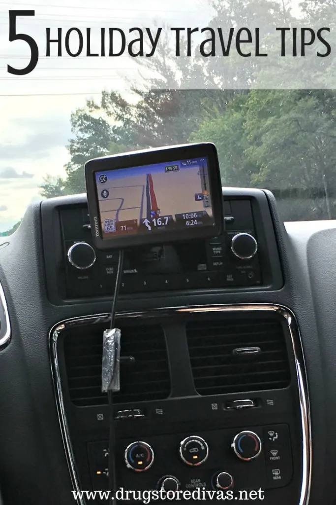 GPS on the front of a car dashboard with the words "5 Holiday Travel Tips" digitally written on top.