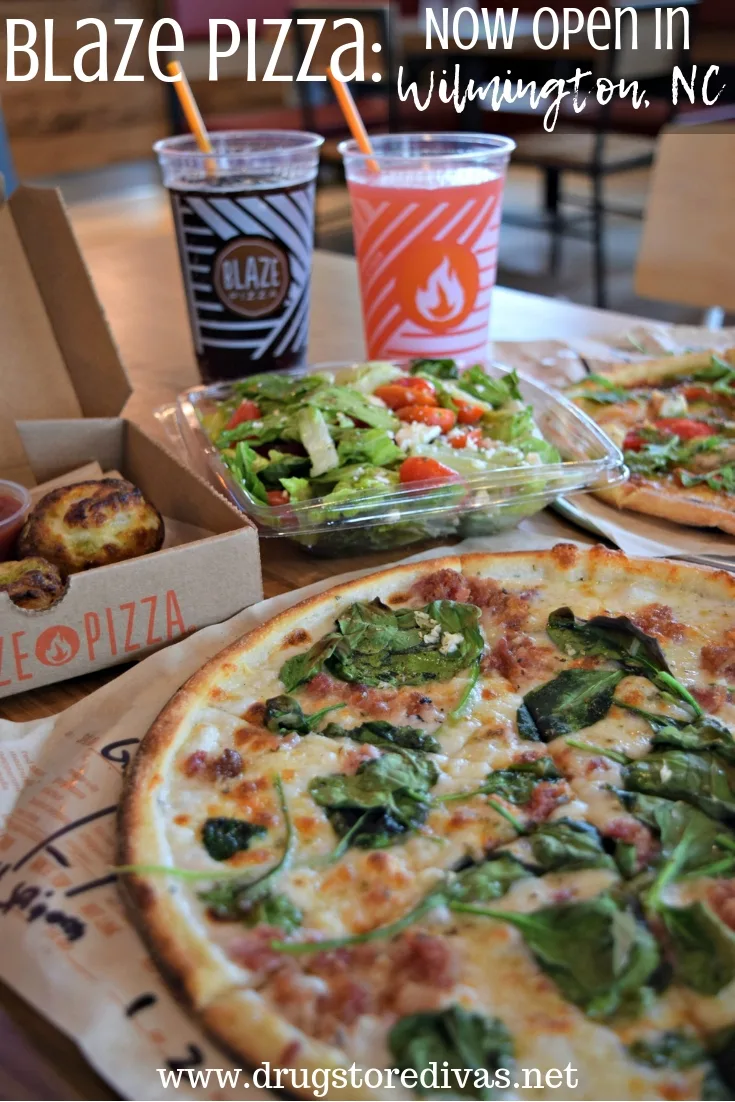 Pizza, drinks, and a salad in a Blaze Pizza restaurant.