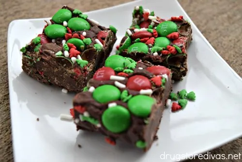 Three pieces of Chocolate Christmas Fudge on a plate.