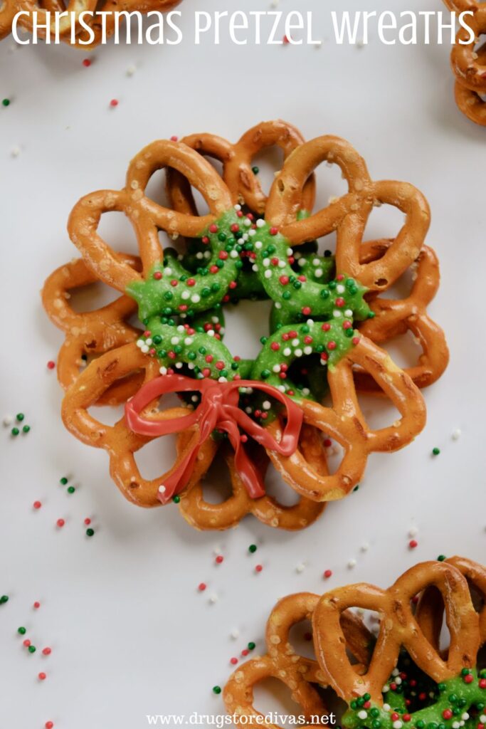Pretzels decorated to look like Christmas wreaths with the words "Christmas Pretzel Wreaths" digitally written on top.