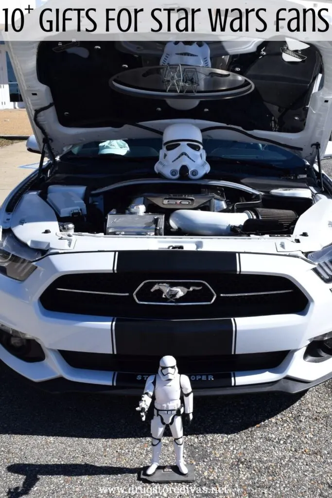 A Stormtrooper figure in front of a white and black car with the words "10+ Gifts For Star Wars Fans" digitally written on top.