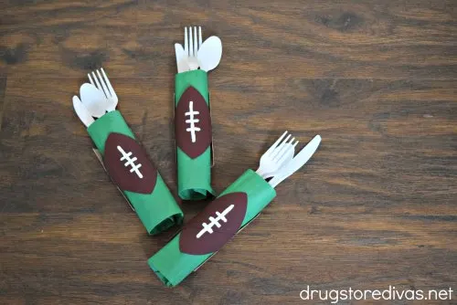 Football-shaped utensil holders made from toilet paper rolls.