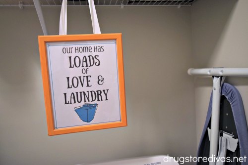 A homemade loads of love and laundry wall hanging.