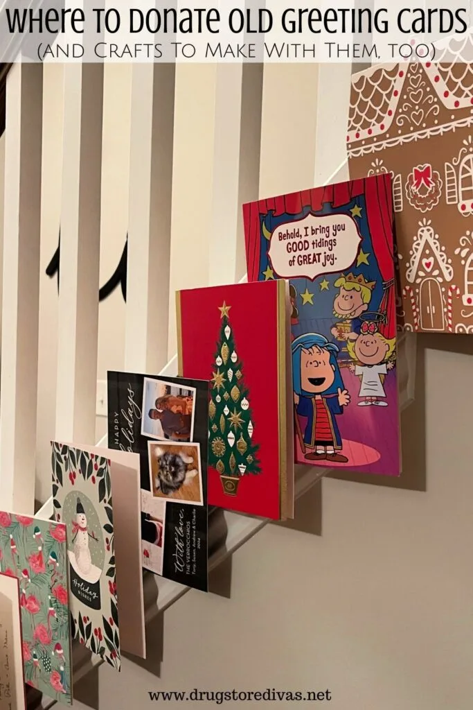 Christmas cards hanging on a staircase with the words "Where to donate old greeting cards and crafts to make with them" digitally written on top.