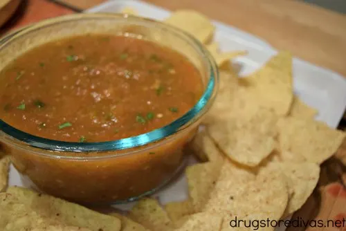 Tortilla chips and salsa on a tray.