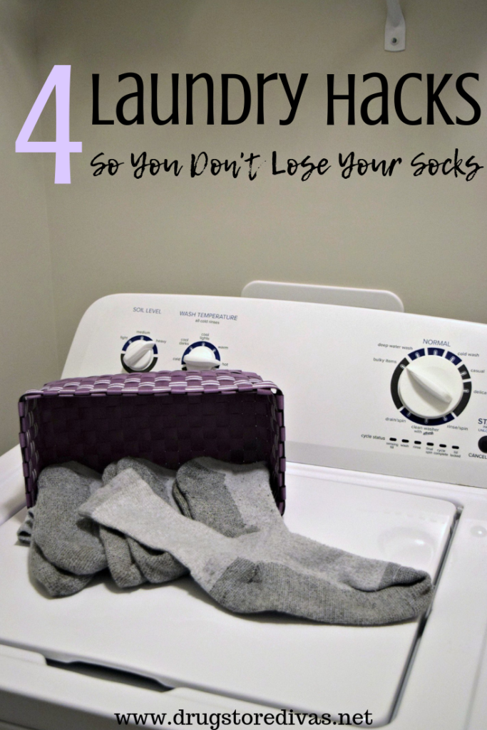 Gray socks coming out of a purple basket on a washing machine with the words "4 Laundry Hacks So You Don't Lose Your Socks" digitally written on top.
