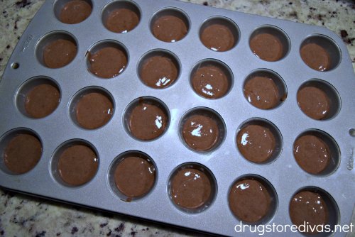 Chocolate batter in a mini muffin pan.