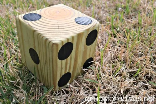 A homemade die made of wood.