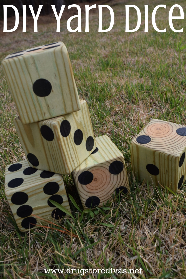 Five homemade lawn dice with the words "DIY Yard Dice" digitally written on top.