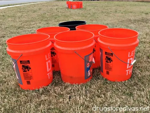 Buckets set up to outdoor beer pong.