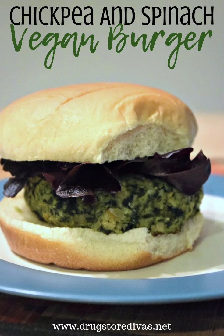 A Chickpea and Spinach Vegan Burger on a blue and white plate.