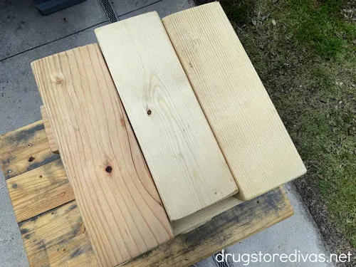 Three cut pieces of 2x4 in a row.