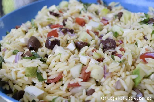 Greek Orzo Salad in a blue bowl.