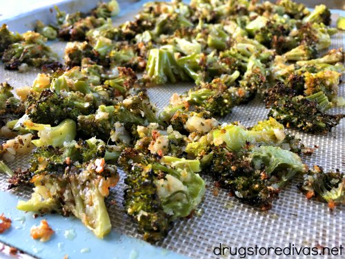 Roasted broccoli on a sheet pan.