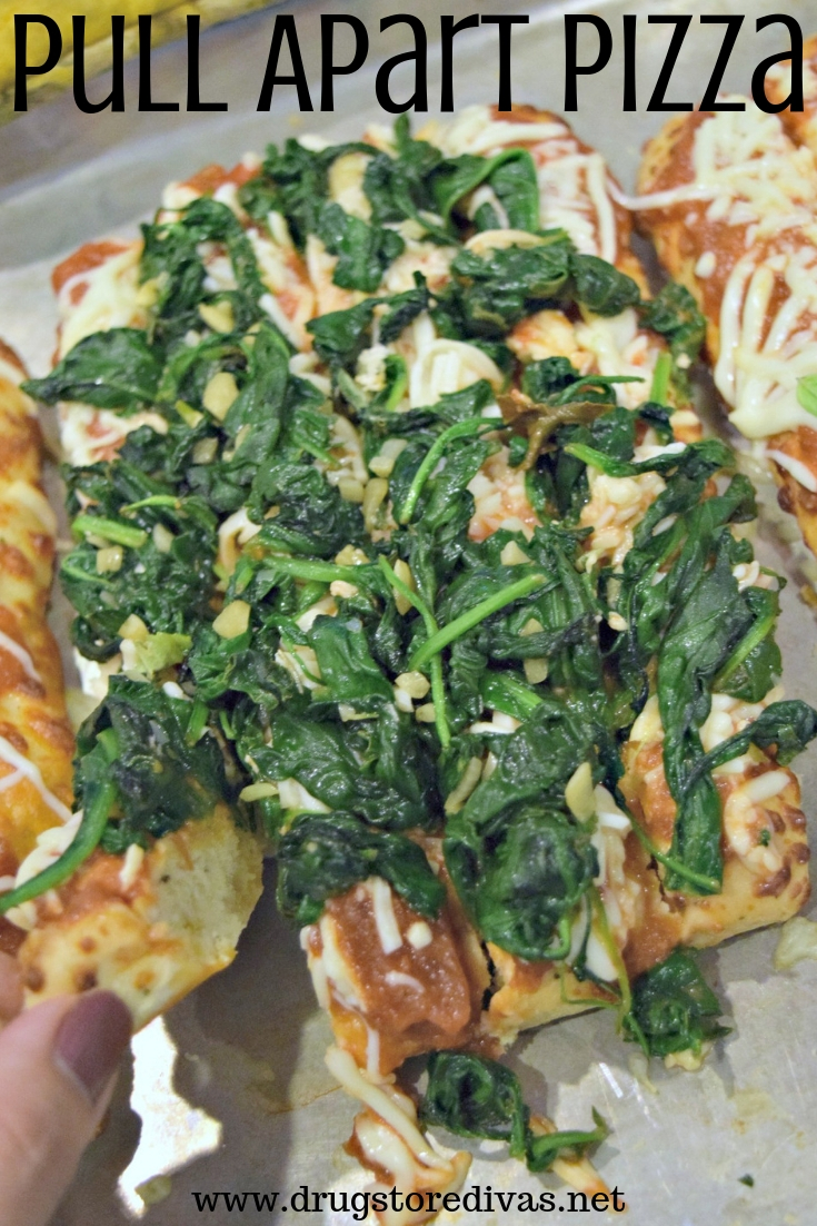 Pieces of a rectangle pizza with spinach on top and the words "Pull Apart Pizza" digitally written on top.