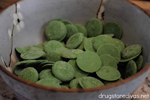 Green candy melts in a bowl.