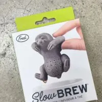 A box with a sloth tea infuser and the words 